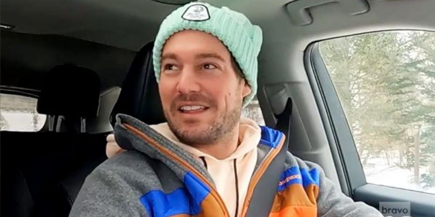 Craig Conover driving a car in the snow on Winter House