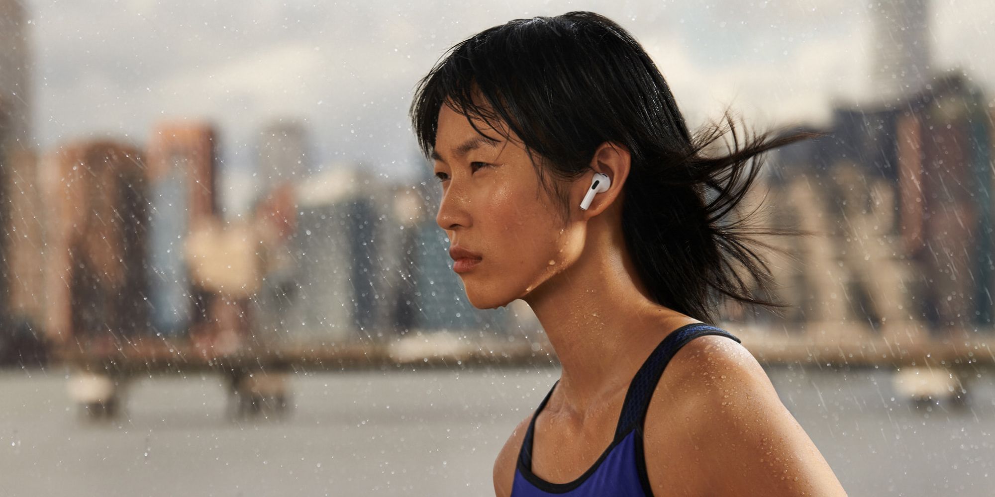 Woman Running In Rain Using Airpods