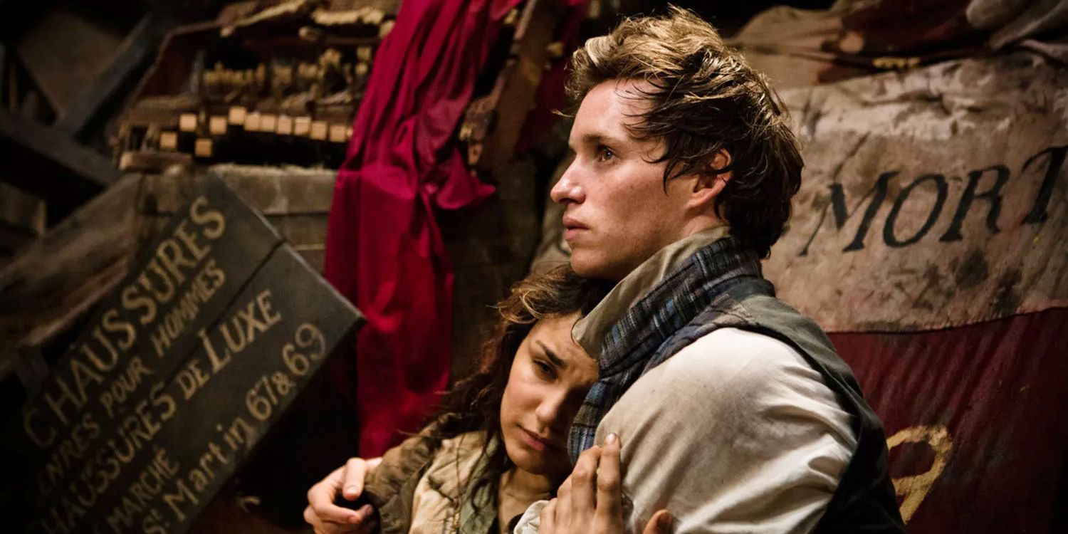 Samantha Barks as Eponine and Eddie Redmayne as Marius in Les Mis