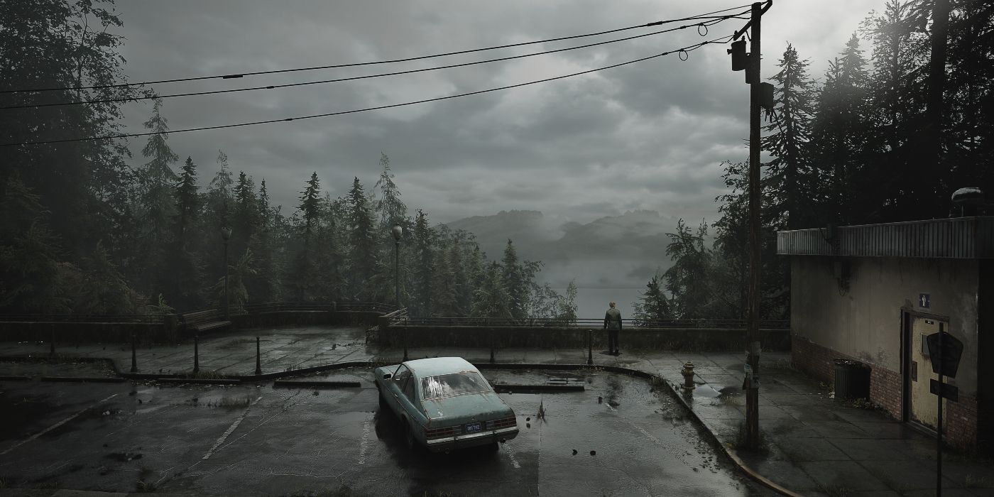 Silent Hill 2's James Sunderland in a parking lot, looking down into the series' iconic fog.