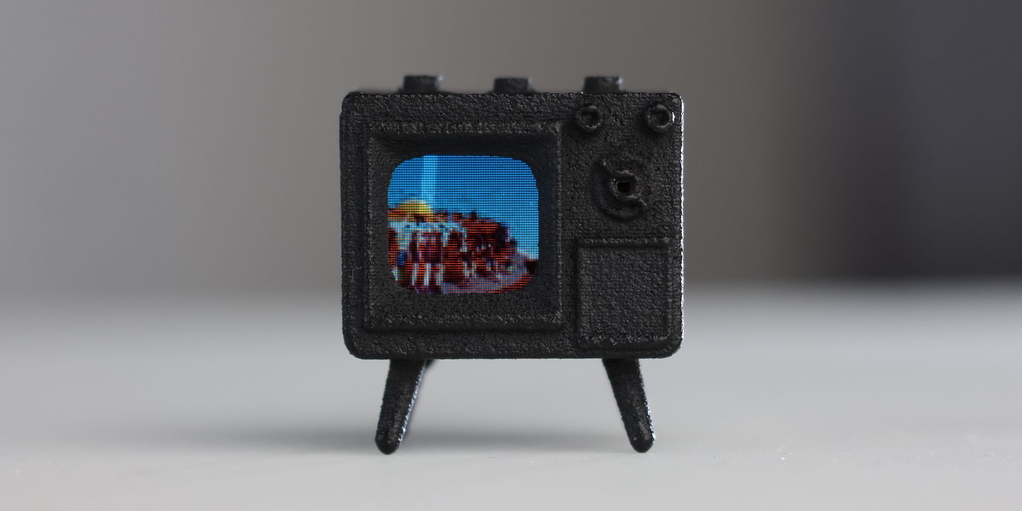 The TinyTV Mini is about the size of a quarter