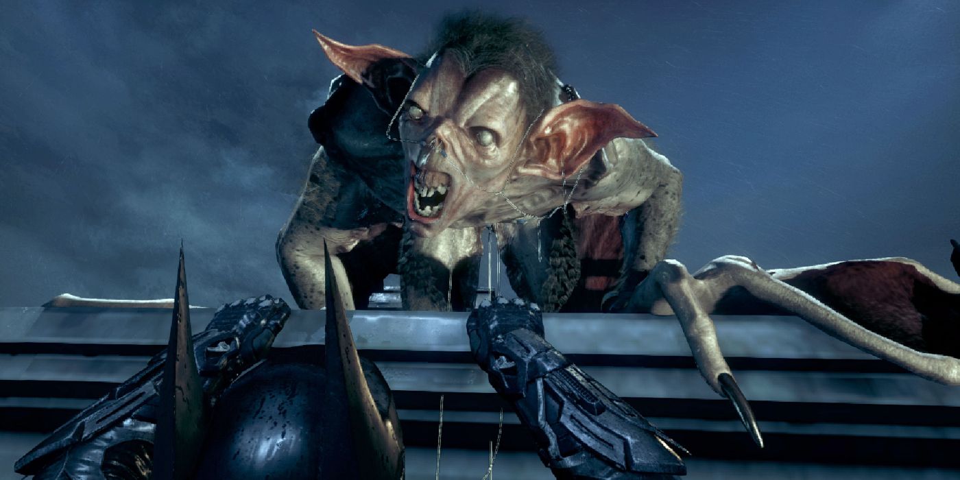 Image of the Man-Bat jumpscare in Batman: Arkham Knight. Batman is dangling off a rooftop ledge while Man-Bat looms menacingly overhead.