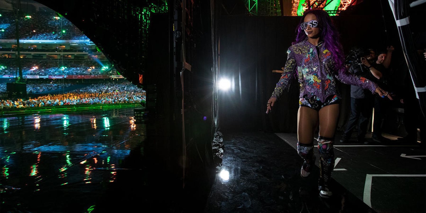 Sasha Banks gets ready to head to the ring in front of a massive WWE crowd.