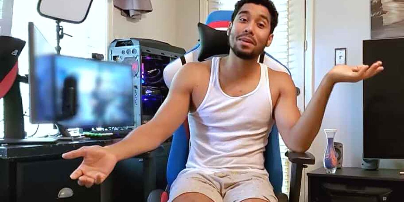 The Family Chantel Pedro Jimeno sitting in front of computer wearing white tank top and shorts