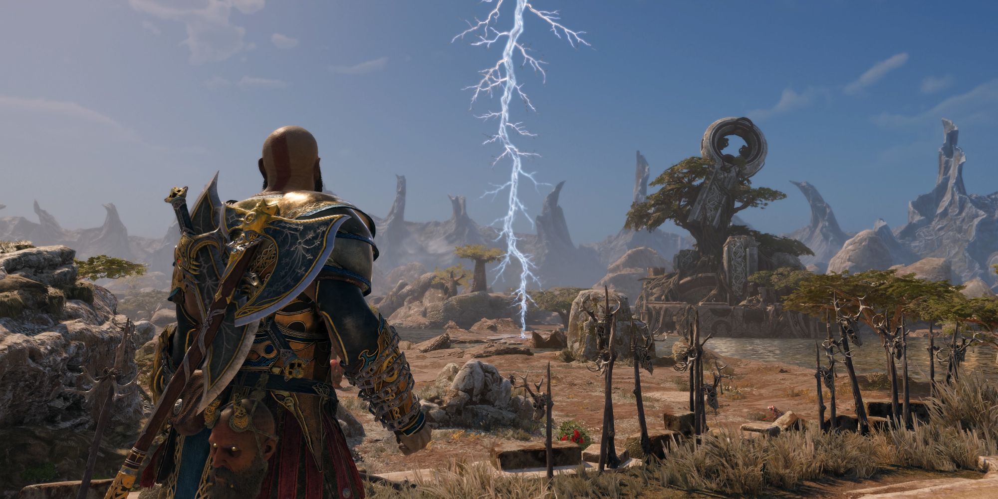The Vanaheim Crater in God of War Ragnarok. Kratos looks out across a vast plain with a mysterious frozen lightning bolt in the middle.