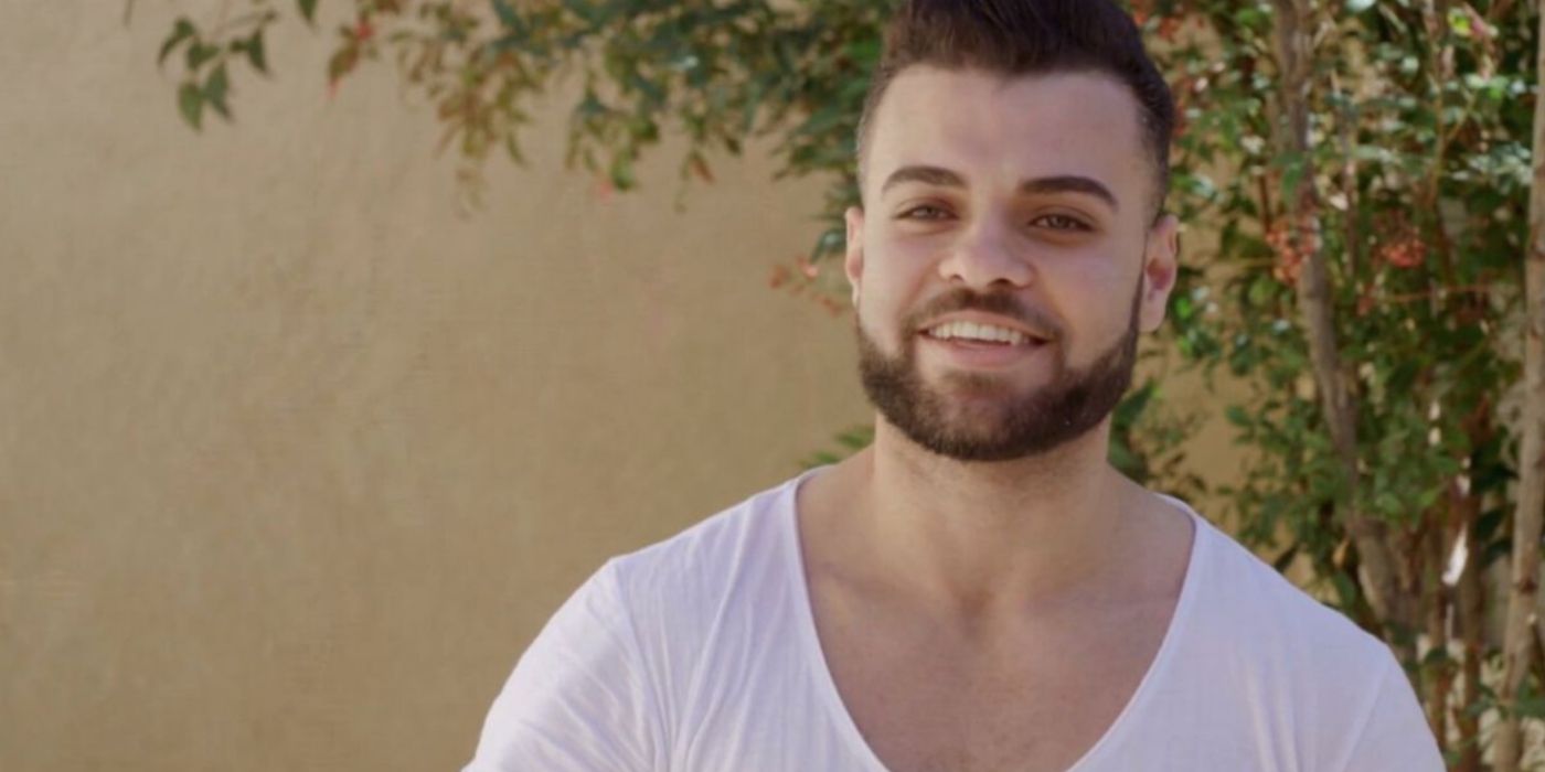 Mohamed Abdelhamed wearing a white u-neck shirt on 90 Day Fiancé