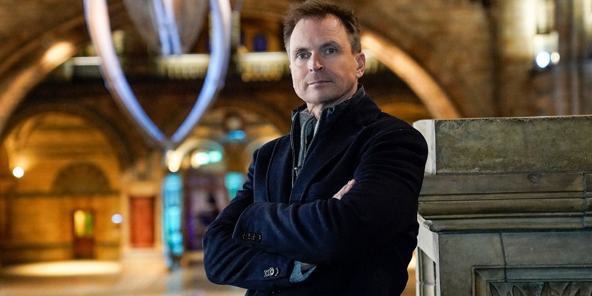 Phil Keoghan from The Amazing Race on set in black jacket