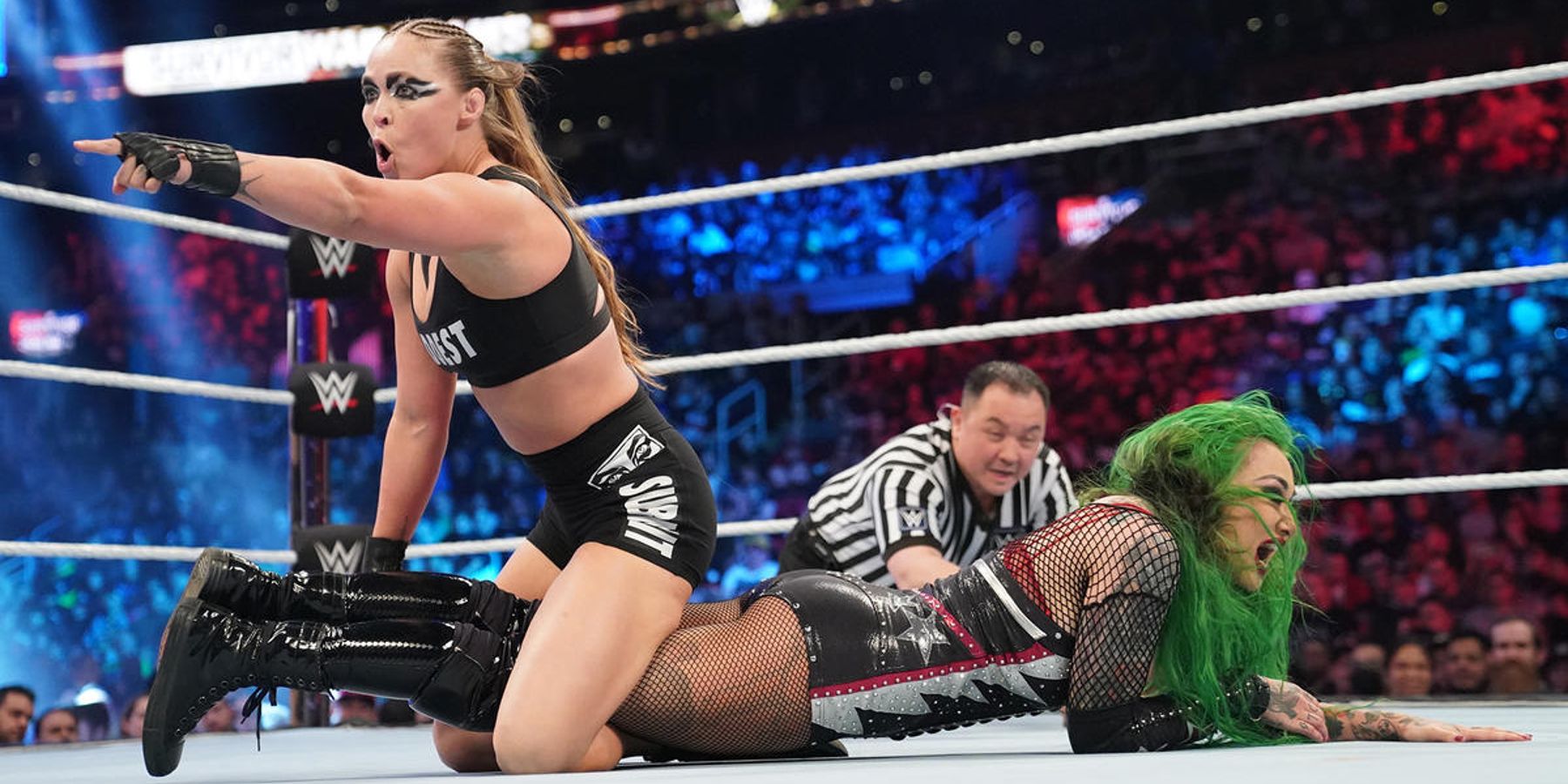 Ronda Rousey prepares to lock Shotzi into a leg submission during a match at WWE Survivor Series.
