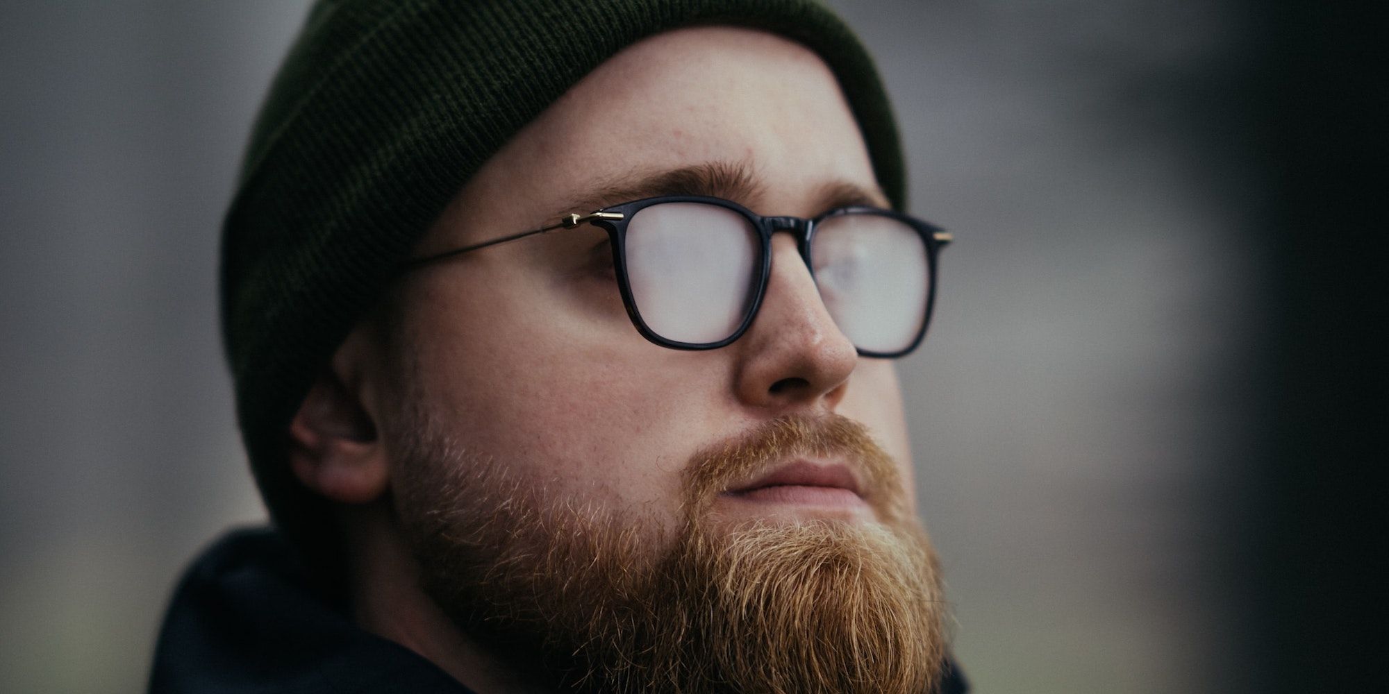 A photo of a man wearing fogged up glasses