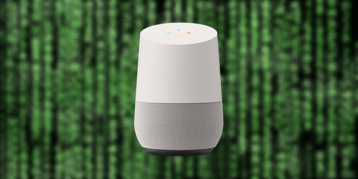 Google Home smart speaker in the foreground with blurred green code in the background