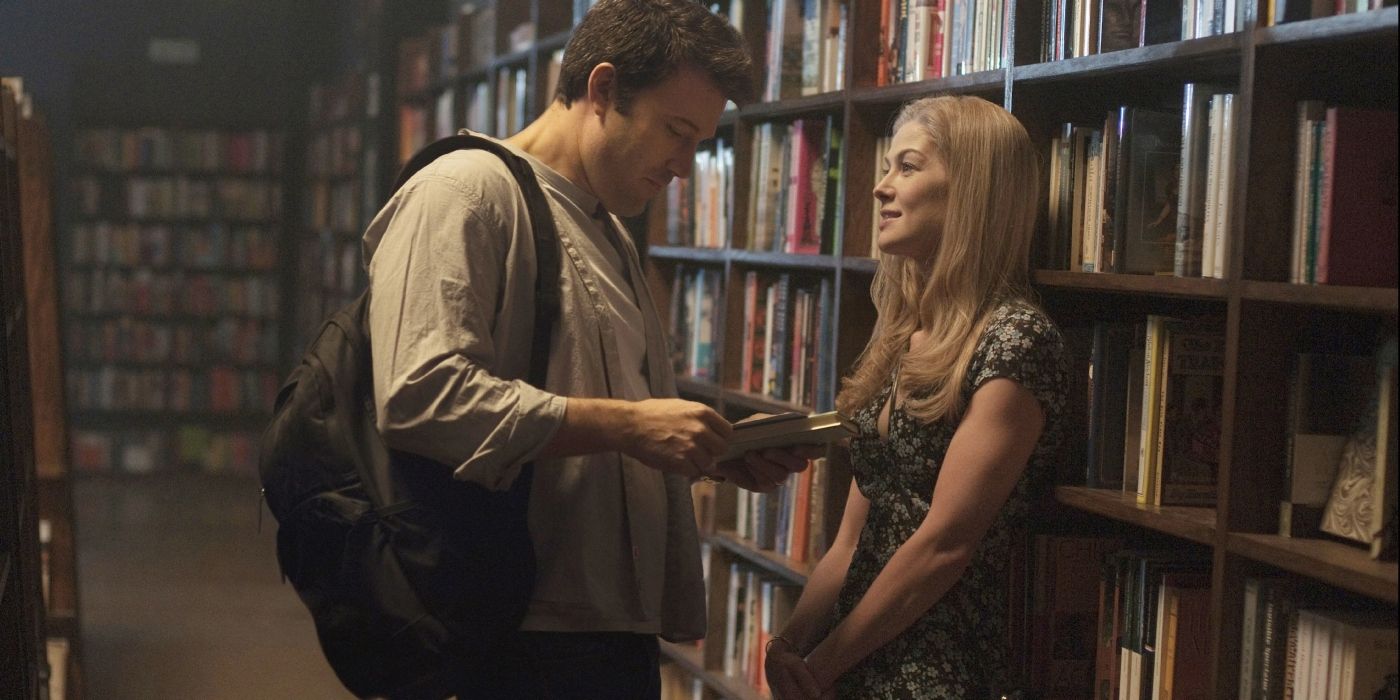 Nick (Ben Affleck) and Amy (Rosamund Pike) standing in a bookstore in Gone Girl