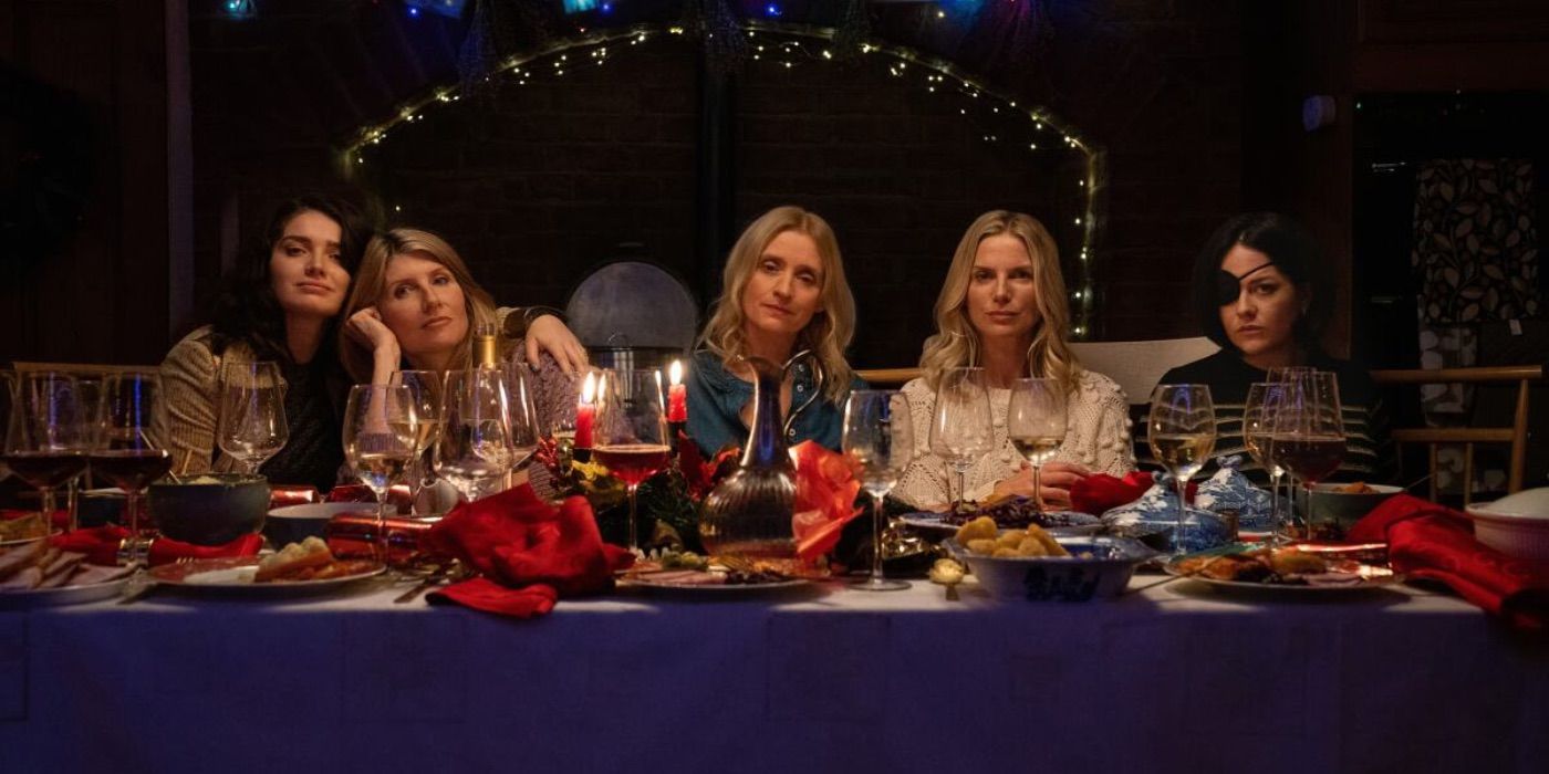 The Garvey sisters sit at a table together in Bad Sisters