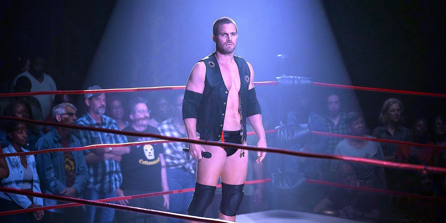 Stephen Amell as Jack Spade standing in the ring In Heels Season 2
