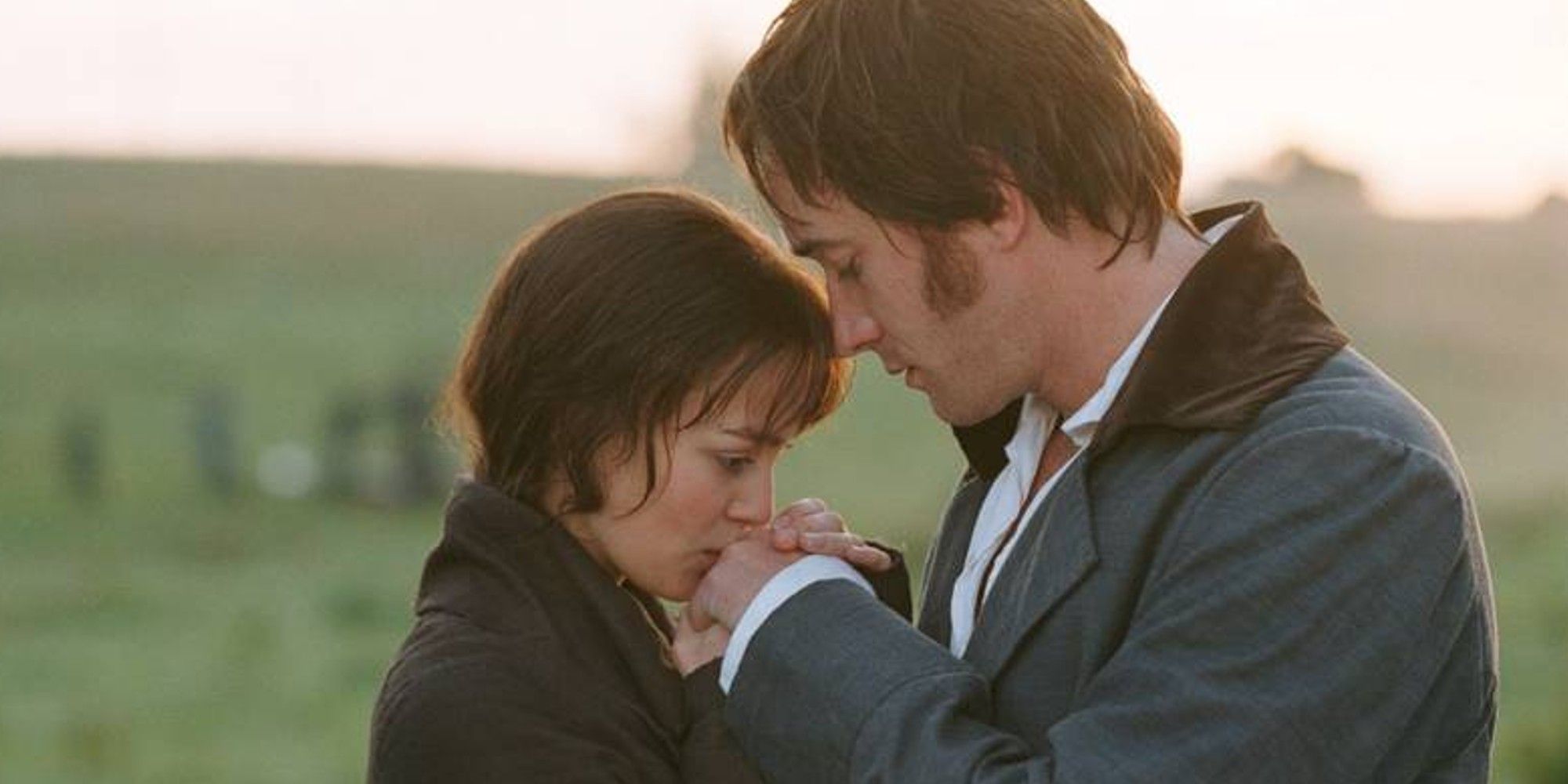 Keira Knightley and Matthew Macfadyen as Elizabeth Bennet and Mr Darcy in a field in Pride & Prejudice