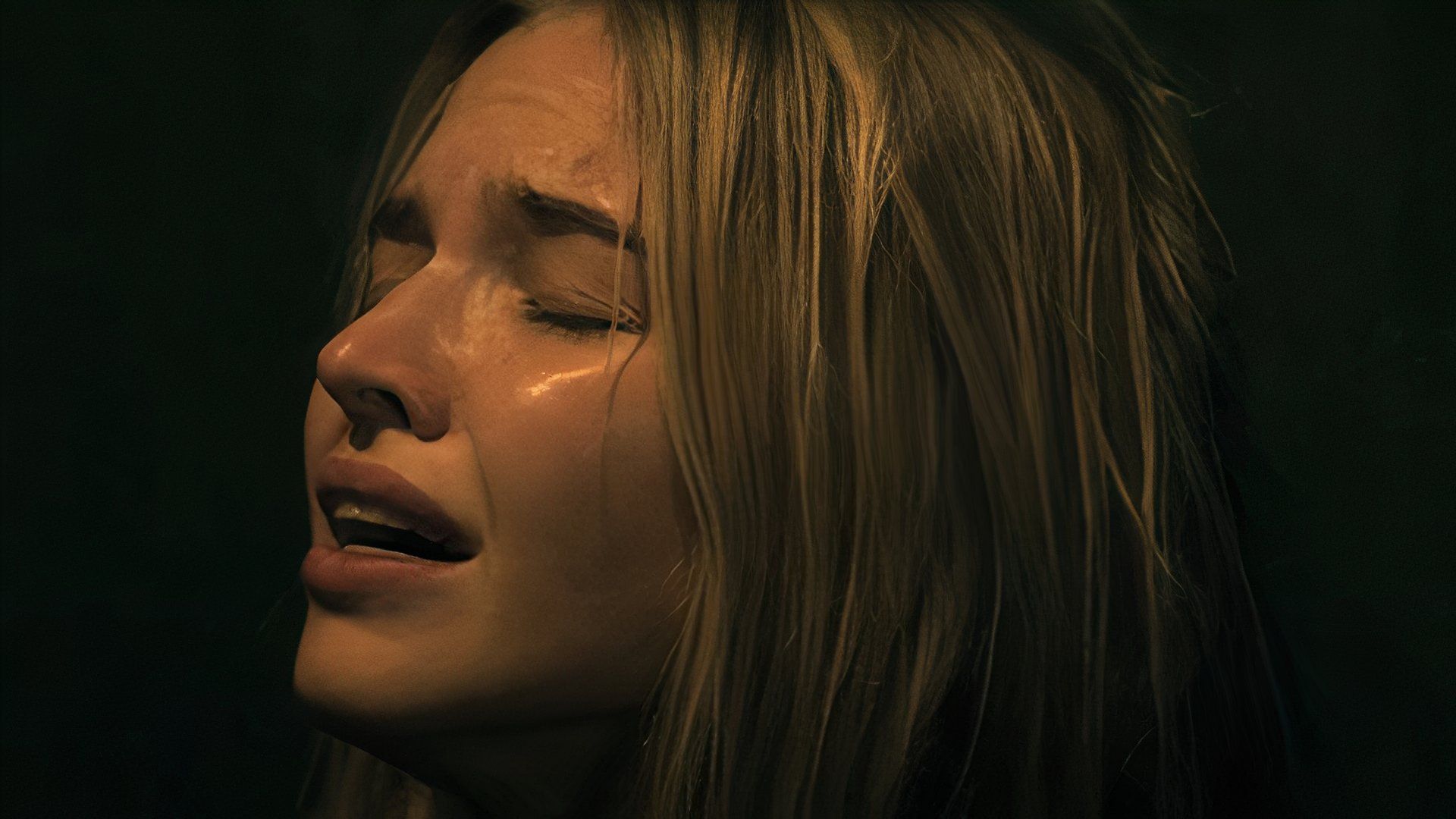 Sasha Luss as Hana with her eyes closed leaning against a wall in Latency