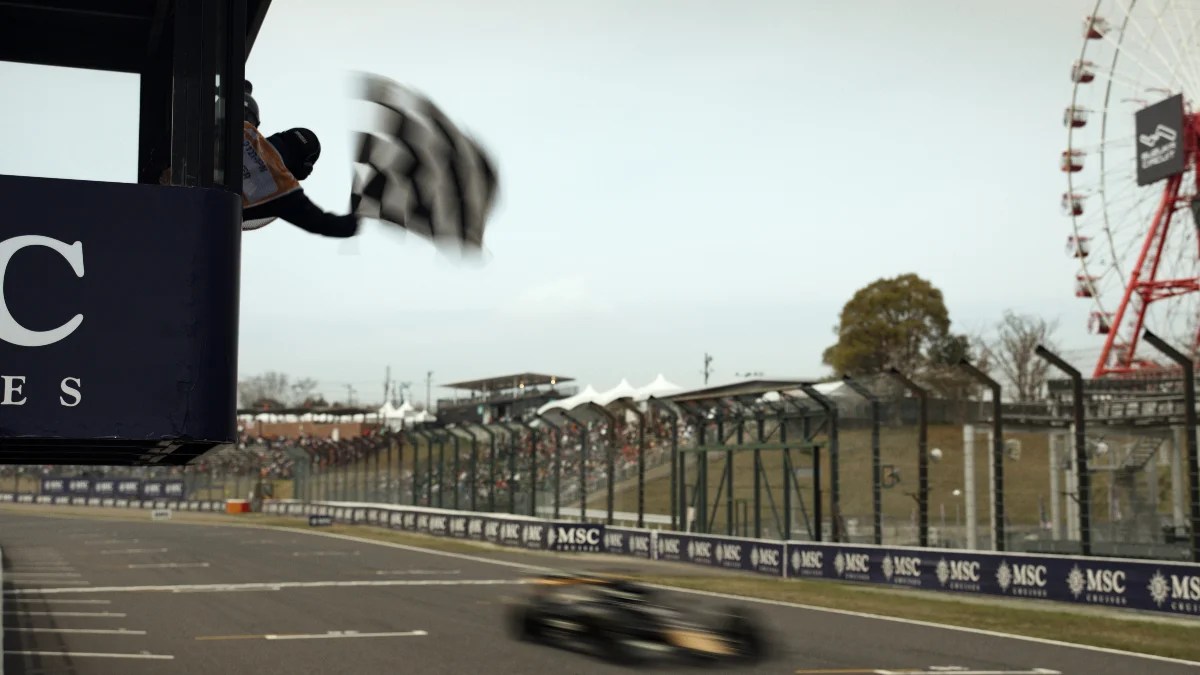A car races by the finish line in